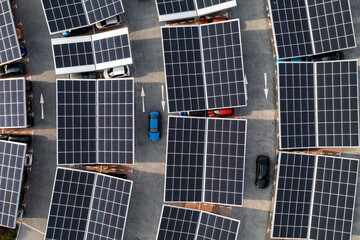 Aerial view of solar panels on a parking lot rooftop