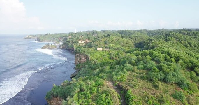 birds eye view of the rocky coastline of the south beach of java island indonesia
