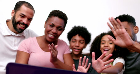 Happy African family talking to relatives on laptop computer