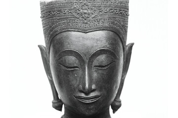 The head of an ancient Buddha statue was made of bronze. image on copy space white background.