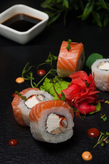 sushi rolls with salmon, cream cheese, omelet and shrimp