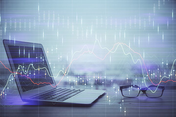 Stock market graph and table with computer background. Multi exposure. Concept of financial...