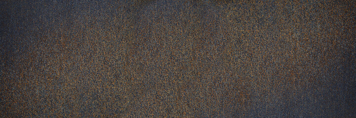 Rust texture. Rough rusty metal surface. Black Brown. Dark grunge background with space for design. Close-up. Web banner. Wide. Panoramic.