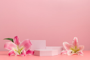 Product podiums with flowers on pink background. Display with lily flowers for cosmetic, perfume...
