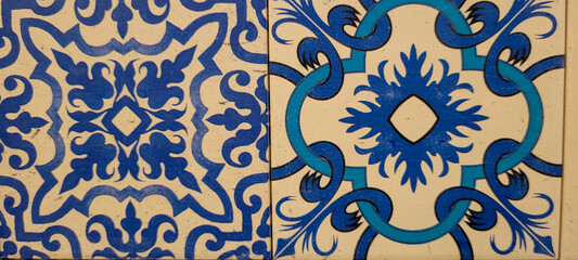 blue and white portuguese tile with drawings