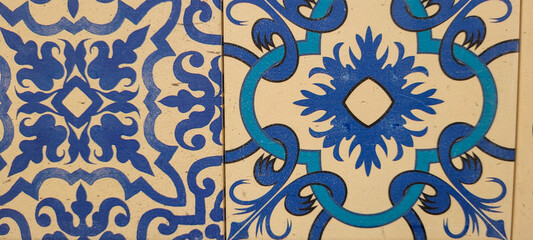 blue and white portuguese tile with drawings