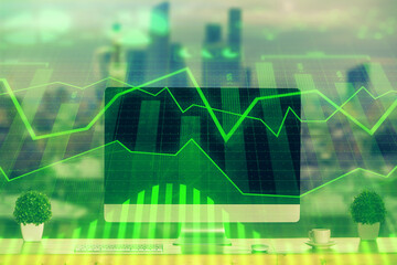 Stock market graph and table with computer background. Multi exposure. Concept of financial analysis.