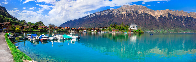 Fototapeta na wymiar Stunning idylic nature scenery of lake Brienz with turquoise waters. Switzerland, Bern canton. Iseltwald village