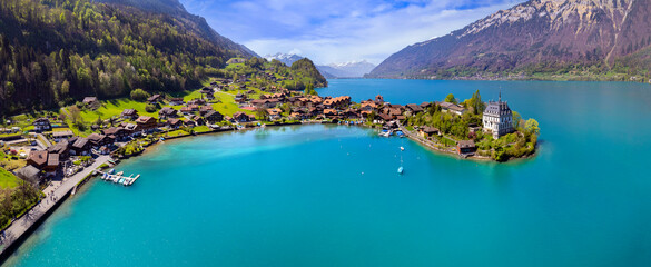 Aereal drone view of stunning idyllic nature scenery of lake Brienz with turquoise waters....