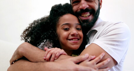 Fototapeta premium Father embracing daughter child. Interracial parent and child relationship