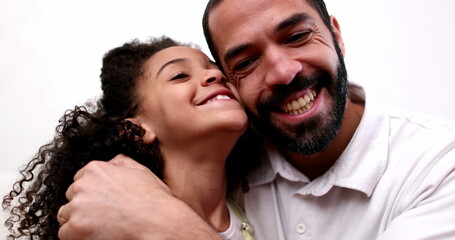 Father and daughter smiling at camera. real casual people. Child and dad