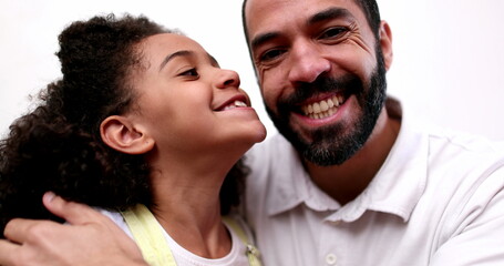 Father and daughter smiling at camera. real casual people. Child and dad