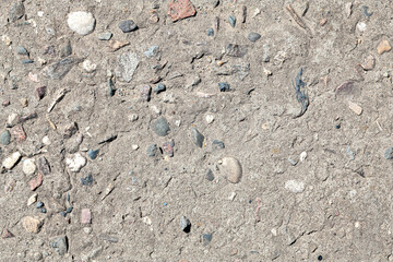 Absolutely seamless texture of rough concrete with stones