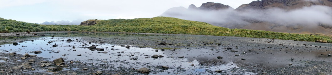 Panorama of a shallow, inland lagoon at Jason Harbor, South Georgia Island