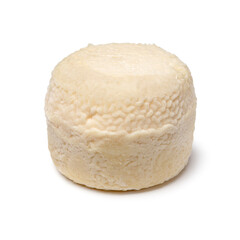 Single traditional small whole goat cheese isolated on white background close up