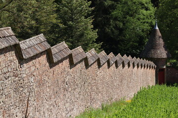 The unusual stepped effect of the wall in an english kitchen garden as it follows the steep slope of the land © Anthony