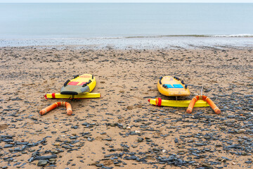 Surf rescue lifeguard  boards and floatation devices on the beach