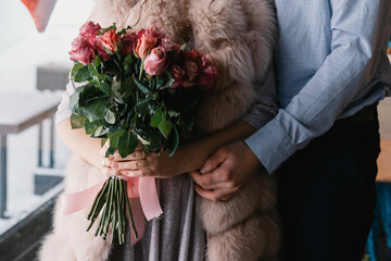 person with a bouquet of roses