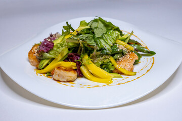 salad with spinach and pork medallions. Useful appetizing salad of vegetables and meat. Restaurant...
