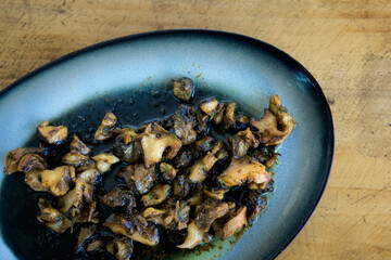 Delicious bulgarian snails in black sauce