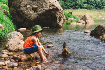 Vacation day , travel and adventure in forest and hiking natural , little girl in touch with nature among the forest . 
