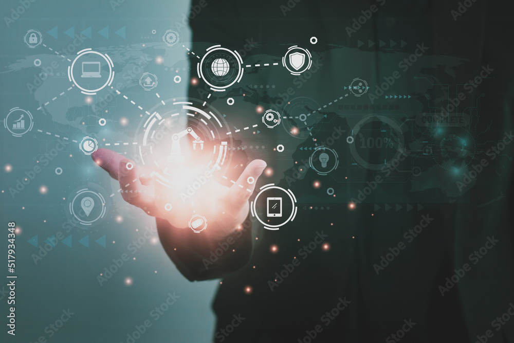 Wall mural engineer holding digital network icon,control automated robot arm machine in factory,machine learnin