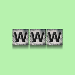 WWW, word on an alphabet on stone blocks, isolated on green background.