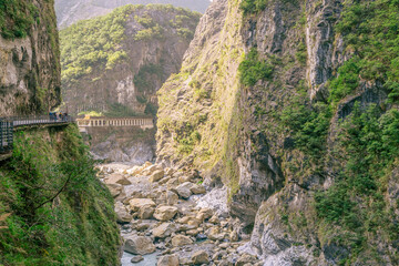 Beautiful natural scenic of the mountain rock with the river and walkway for sightseeing.