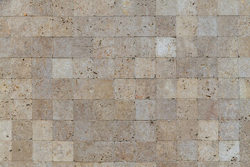 Yellow stone tiles masonry closeup background