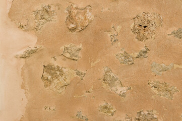 old textured wall with stones