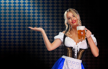 Young sexy Oktoberfest girl waitress, wearing a traditional Bavarian or german dirndl, serving big...