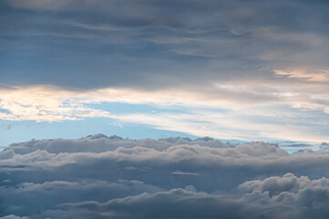 grey clouds in  bright sky