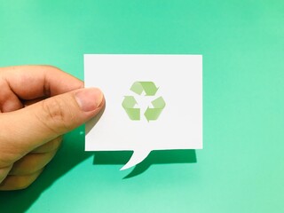 hand holding recycle symbol