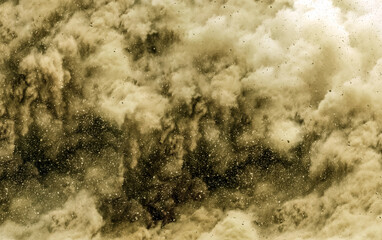 Rock debris and dust storm after detonator blasting on the miming site 