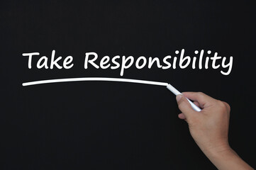 Take 100 percentage responsibility reminder note written on blackboard. Responsibility concept