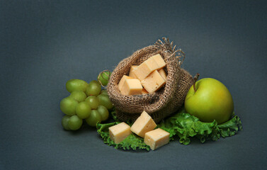 pieces of cheese in a small bag of burlap