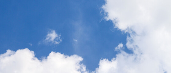 Obraz premium Cloudscape - Blue clear sky and white clouds, wide panorama The vast blue sky and clouds sky