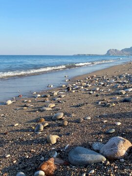 Pebble stones on the sea beach. Afandou (Afantou) beach, Rhodes island, Greece. 