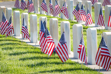 Military Headstones and Gravestones Decorated With Flags for Memorial Day