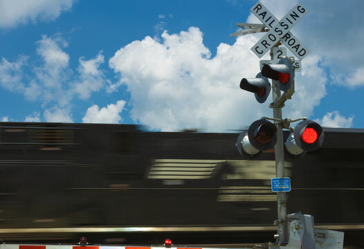 Train zooms through a crossing in rural Tennessee