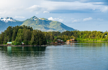 Mountains surrounding the islands of Sitka in Alaska with small homes and cabins