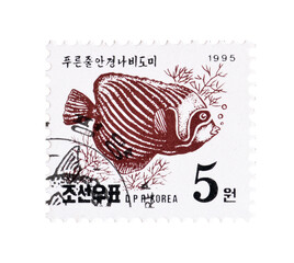 Cancelled postage stamp printed by North Korea, that shows Pennant Coral fish (Heniochus...