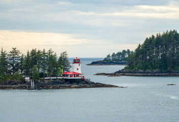 Light house on the rocks on island in the bay of Sitka in Alaska