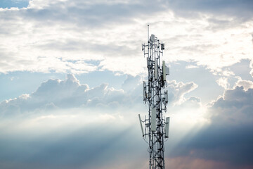 Communication tower top. Radio antenna Tower , microwave antenna tower on light sky background. wireless technology concept. communication development concept. image for objects and article. - obrazy, fototapety, plakaty