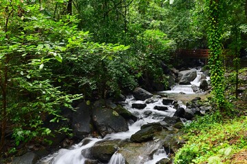 Beautiful Waterfall and Bridge at Ngao Waterfall National Park in Ranong Province