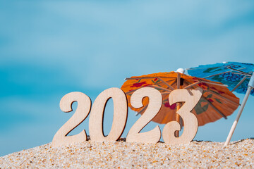 new year's rooms in 2023 on the beach by the sea with decorative bright umbrellas. tourism,...