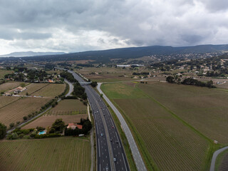 Aerial panoramic view on speedway and rows of grape plants on vineyards in Bandol wine making region, Provence, South of France