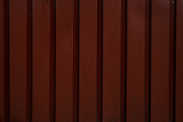 Fragment of wooden planks with brown paint. Wooden background texture surface