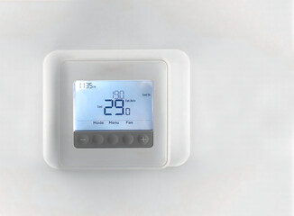 A Programmable thermostat on a wall that manage  home heating and cooling