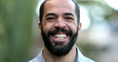 Fototapeta premium Happy hispanic man spontaneous smile and laugh